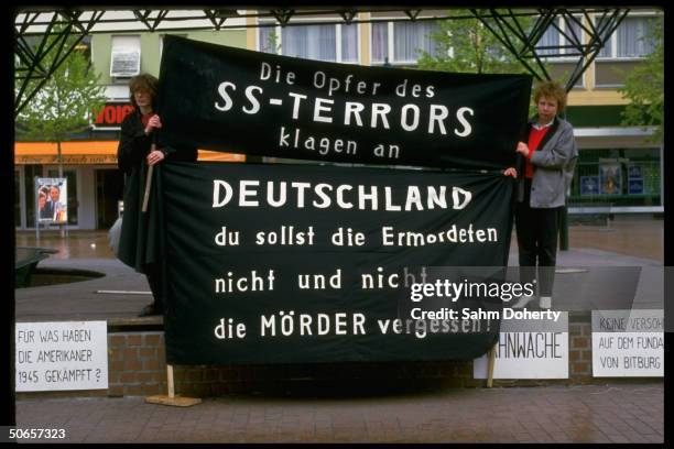 Demonstrators w. Signs at Jewish protest in remembrance of Holocaust, against Pres. Ronald Reagan's visit to Bitburg cemetery outside CDU HQ