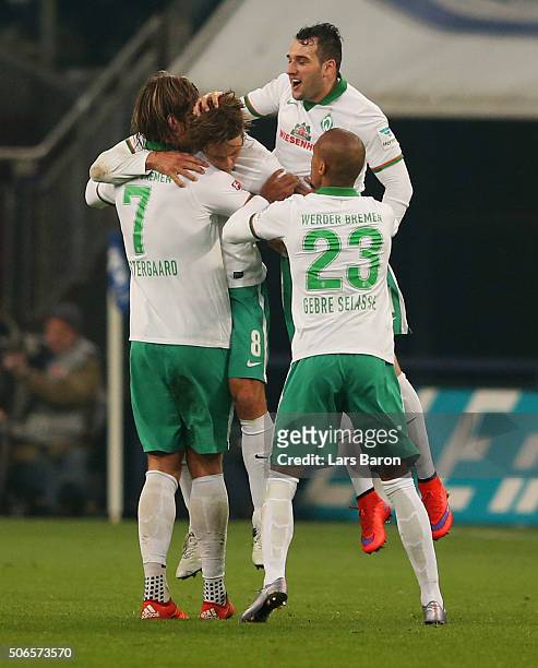 Clemens Fritz of Werder Bremen celebrates with team mates as he scores their first and equalising goal during the Bundesliga match between FC Schalke...