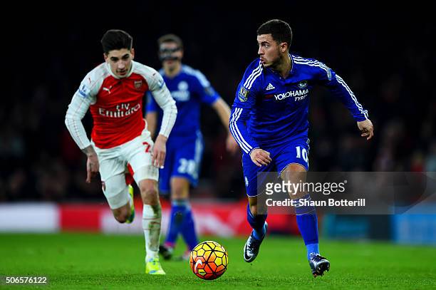 Eden Hazard of Chelsea runs with the ball under pressure from Hector Bellerin of Arsenal during the Barclays Premier League match between Arsenal and...