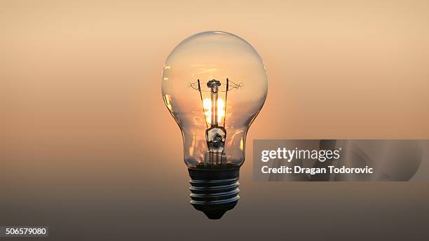 sunset - light bulb fotografías e imágenes de stock