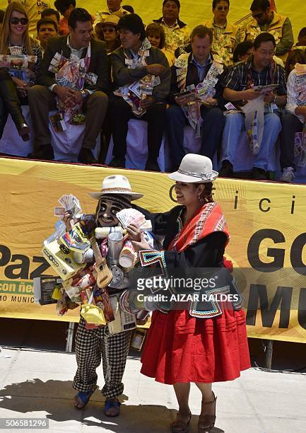 Bolivian President Evo Morales and La Paz Mayor Luis Revilla watch a dance in homage to Ekeko, the Aymara god of abundance, at the start of the...