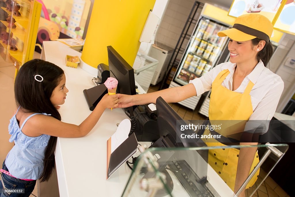 Girl buying an ice cream at a shop