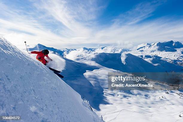 female athlete making a powder turn - whistler stock pictures, royalty-free photos & images