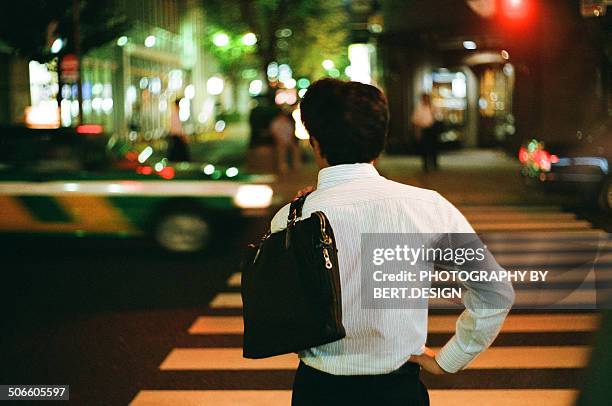 business man waiting for traffic light - road signal stock pictures, royalty-free photos & images