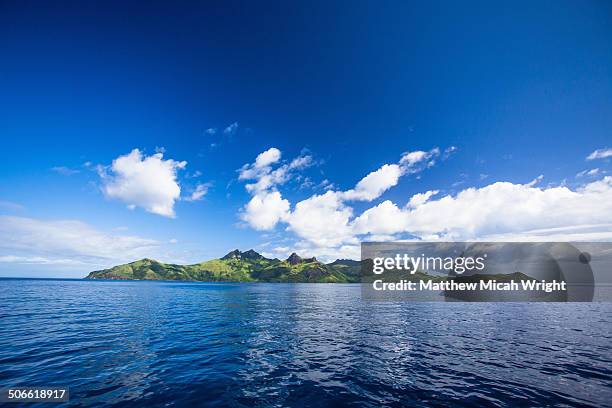 a boat cruise through the yasawa islands. - fiji cruise stock pictures, royalty-free photos & images