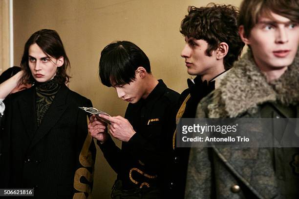 Models poses Backstage prior the Dries Van Noten Menswear Fall/Winter 2016-2017 show as part of Paris Fashion Week on January 21, 2016 in Paris,...