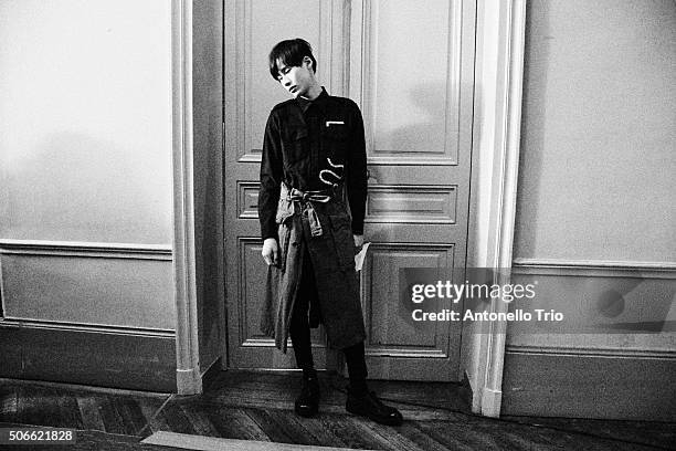 Image has been converted to black and white.) A model poses Backstage prior the Dries Van Noten Menswear Fall/Winter 2016-2017 show as part of Paris...