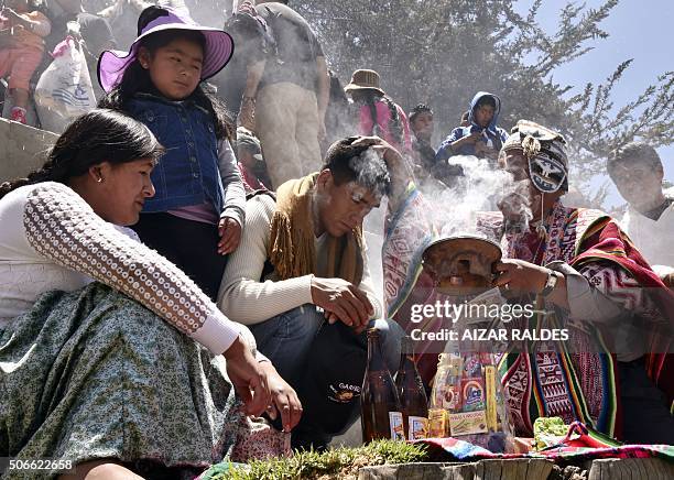 Yatiri or Aymara priest performs an offering ceremony at the start of the Alasitas festival on January 24 , 2016 in La Paz. The month-long annual...