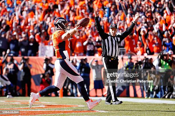 Owen Daniels of the Denver Broncos scores a 21-yard first quarter touchdown against the New England Patriots in the AFC Championship game at Sports...
