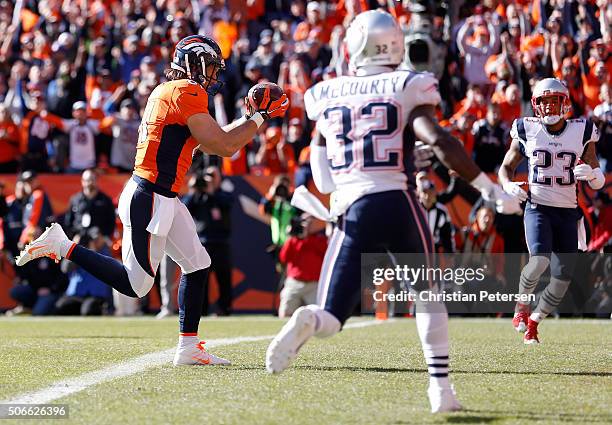 Owen Daniels of the Denver Broncos scores a 21-yard first quarter touchdown against the New England Patriots in the AFC Championship game at Sports...