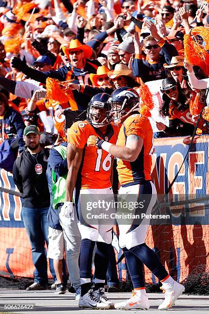 Owen Daniels of the Denver Broncos celebrates with Bennie Fowler after scoring a 21-yard first quarter touchdown against the New England Patriots in...