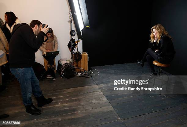 Photograher Jeff Vespa and actress Natasha Lyonne behind the scenes in the WireImage Portrait Studio at the Eddie Bauer Adventure House during the...