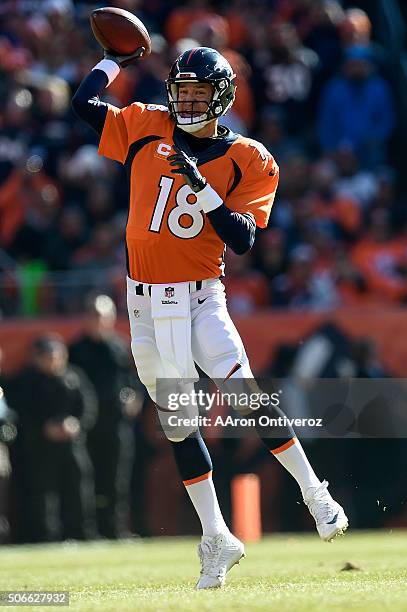 Peyton Manning of the Denver Broncos makes a pass on the run in the first quarter. The Denver Broncos played the New England Patriots in the AFC...