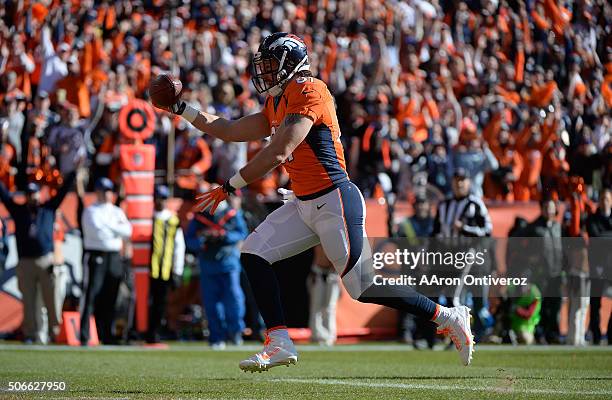 Owen Daniels of the Denver Broncos runs into the end zone for a touchdown in the first quarter. The Denver Broncos played the New England Patriots in...