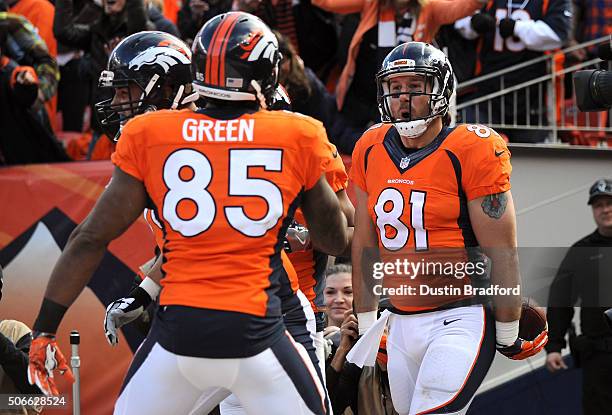 Owen Daniels of the Denver Broncos celebrates after scoring a 12-yard touchdown in the second quarter against the New England Patriots in the AFC...