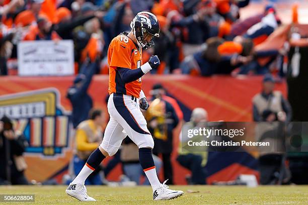 Peyton Manning of the Denver Broncos celebrates after passing for a 12-yard touchdown in the second quarter against the New England Patriots in the...