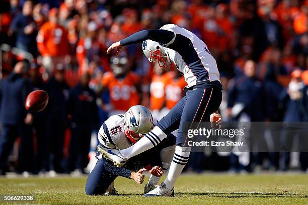 Stephen Gostkowski of the New England Patriots misses an extra point in the first quarter held by Ryan Allen against the Denver Broncos in the AFC...