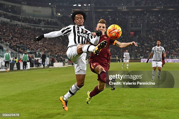 Juan Cuadrado of Juventus FC competes with Lucas Digne of AS Roma during the Serie A match between Juventus FC and AS Roma at Juventus Arena on...