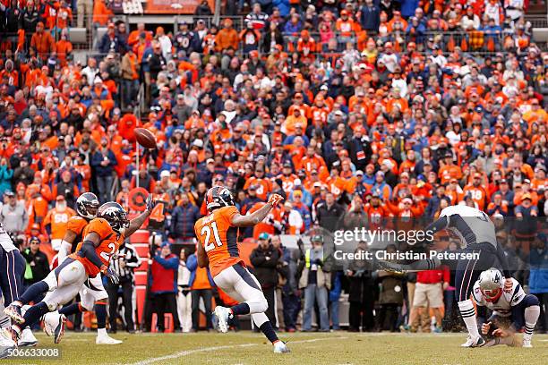 Stephen Gostkowski of the New England Patriots kicks a 38-yard field goal held by Ryan Allen in the third quarter against the Denver Broncos in the...