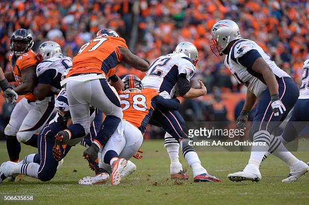 Tom Brady of the New England Patriots is sacked by Von Miller of the Denver Broncos in the third quarter. The Denver Broncos played the New England...