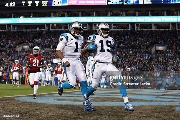 Cam Newton of the Carolina Panthers celebrates as Ted Ginn Jr. #19 scores a touchdown in the first quarter against the Arizona Cardinals during the...