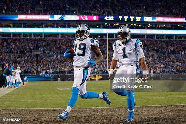 Cam Newton of the Carolina Panthers celebrates as Ted Ginn Jr. #19 scores a touchdown in the first quarter against the Arizona Cardinals during the...