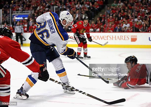 Niklas Hjalmarsson of the Chicago Blackhawks dives to stop a shot by Troy Brouwer of the St. Louis Blues at the United Center on January 24, 2016 in...