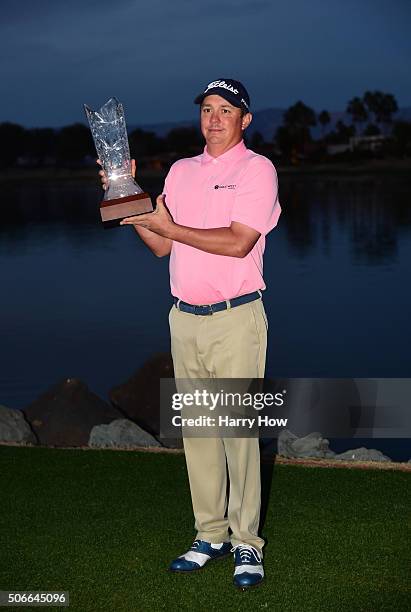 Jason Dufner poses with the trophy after winning the CareerBuilder Challenge In Partnership With The Clinton Foundation at the TPC Stadium course at...