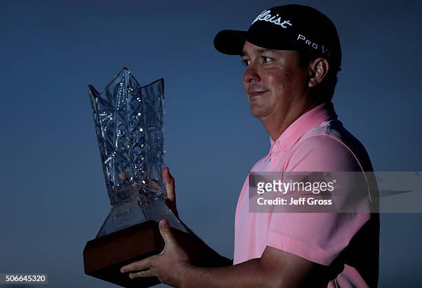 Jason Dufner poses with the trophy after winning the CareerBuilder Challenge In Partnership With The Clinton Foundation at the TPC Stadium course at...