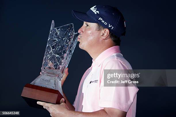 Jason Dufner poses with the trophy after winning the CareerBuilder Challenge In Partnership With The Clinton Foundation at the TPC Stadium course at...