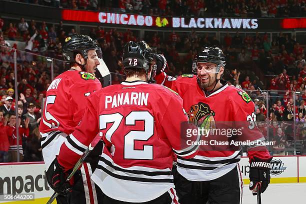 Artem Anisimov, Michal Rozsival and Artemi Panarin of the Chicago Blackhawks celebrate after Panarin scored against the St. Louis Blues in the second...