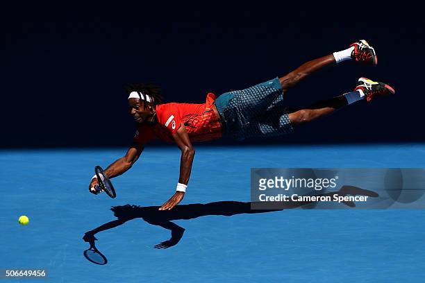 Gael Monfils of France dives for a forehand in his fourth round match against Andrey Kuznestov of Russia during day eight of the 2016 Australian Open...