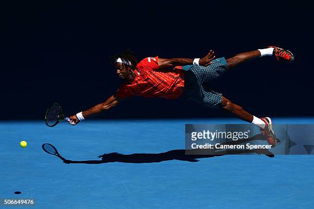 Gael Monfils of France dives for a forehand in his fourth round match against Andrey Kuznestov of Russia during day eight of the 2016 Australian Open...