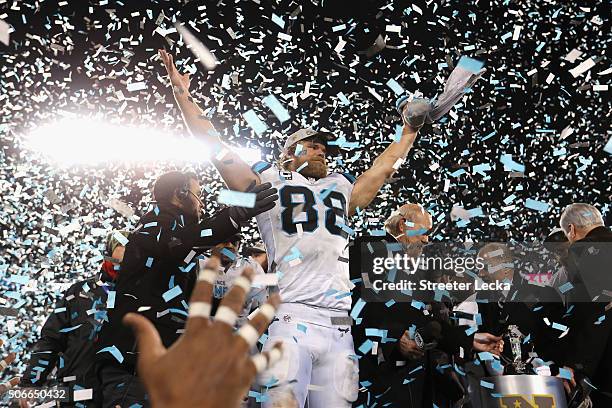 Greg Olsen of the Carolina Panthers celebrates defeating the Arizona Cardinals with a score of 49 to 15 to win the NFC Championship Game at Bank of...