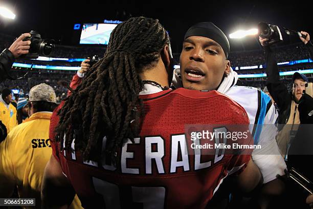 Larry Fitzgerald of the Arizona Cardinals greets Cam Newton of the Carolina Panthers after the Carolina Panthers defeated the Arizona Cardinals with...