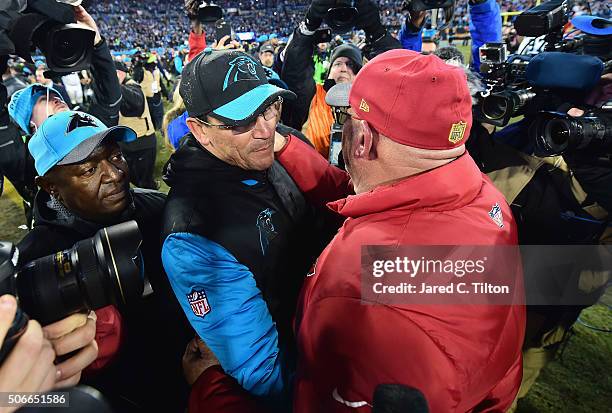 Head coach Ron Rivera of the Carolina Panthers shakes hands with head coach Bruce Arians of the Arizona Cardinals after the Carolina Panthers...