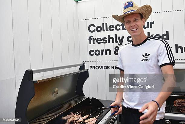 Tomas Berdych of Czech Republic cooking an Australian barbeque ahead of Australia Day during day eight of the 2016 Australian Open at Melbourne Park...