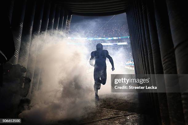 Ed Dickson of the Carolina Panthers runs out of the tunnel prior to the NFC Championship Game against the Arizona Cardinals at Bank of America...