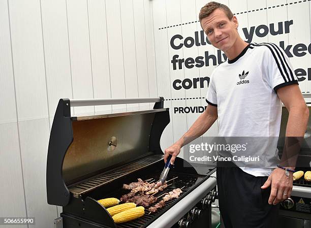 Tomas Berdych of Czech Republic cooking an Australian barbeque ahead of Australia Day during day eight of the 2016 Australian Open at Melbourne Park...