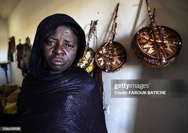 Tuareg woman who is an imzad instrument maker poses for a picture at the "Home of the Imzad" in Tamanrasset in Southern Algeria, on January 12, 2016....
