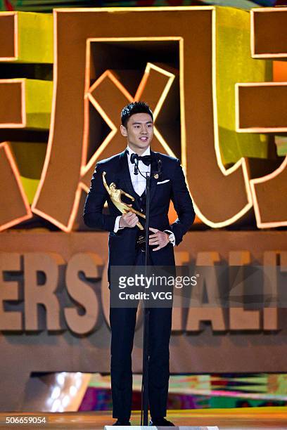 Chinese swimmer Ning Zetao poses with the trophy during the Sports Personality of the Year 2015 on January 24, 2016 in Beijing, China.