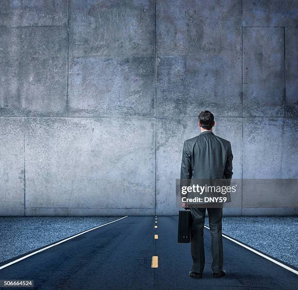 businessman looking at the end of the road - dead end stock pictures, royalty-free photos & images