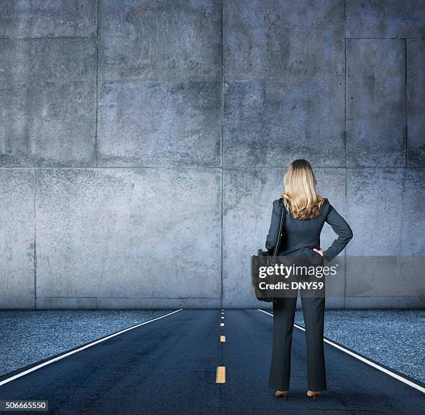 businesswoman looking at the end of the road - dead end stock pictures, royalty-free photos & images