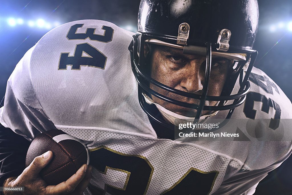 Player running with football