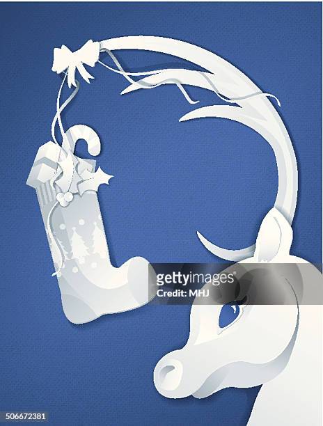 paper cut reindeer with christmas stocking collage on blue - mhj stock illustrations