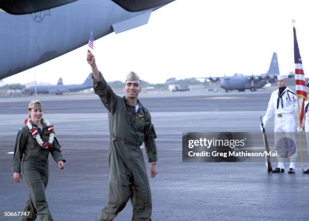 Crew members from U.S. Navy EP-3 Aries II aircraft involved in the April 1 accident with a Chinese F-8 aircraft being welcomed by senior military...