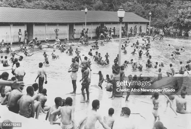 African-American children playing in a pool at Druid Hill Park during an Independence Day celebration, Baltimore, Maryland, 1950.