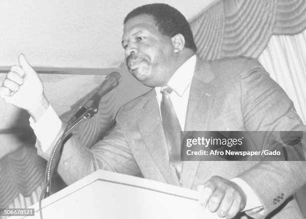 Politician and Maryland congressional representative Elijah Cummings speaking at a podium, 1994.