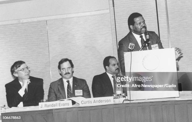 Politician and Maryland congressional representative Elijah Cummings speaking at a podium, 1988.