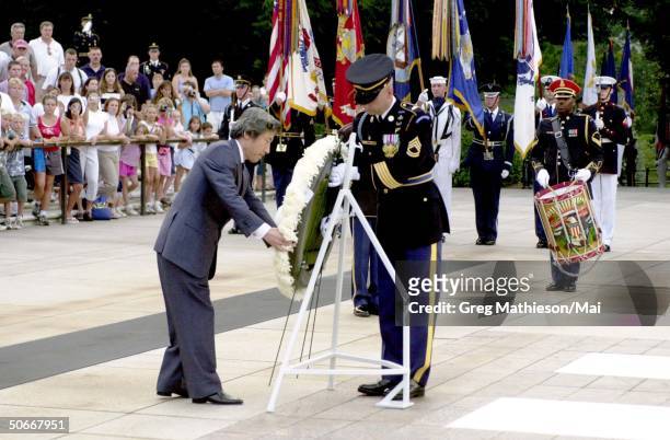 Japanese Prime Minister Junichiro Koizumi laying a wreath at the Tomb of the Unknowns at Arlington cemetery.